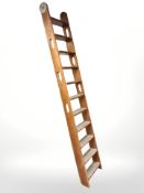 A ship's teak eleven-tread ladder, length 246 cm.