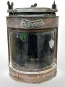 A copper ship's stern lamp, electric, height 36cm.