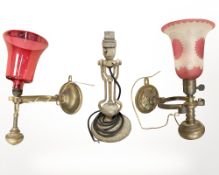 A brass ship's gimbal table lamp, and two further gimbal wall lights,