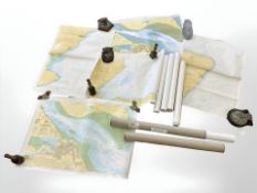 A collection of rolled sea and river charts, including Scotland,