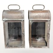 A pair of copper and glass hurricane lamps, height 34cm.