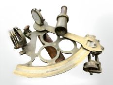 A Kelvin Hughes brass sextant, width 25cm.