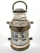 A brass ship's masthead lamp, wired for electricity, height 29cm.