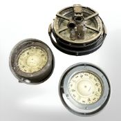 Three ship's compasses including a Kelvin Hughes example, largest 20cm diameter.