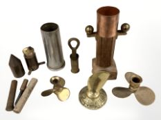 A brass advertising paperweight in the form of a propeller manufactured by M Wawn & Son,