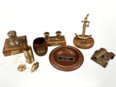 A group of salvaged ship ornaments and trinkets including a small desk cannon and further anchor