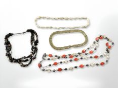 Two multi-strand polished stone necklaces,