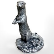 A silver -overlaid figure of an otter, issued by Country Artists, fully hallmarked, height 13 cm.