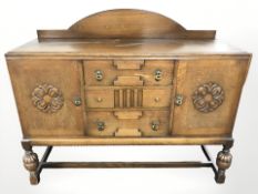 An early 20th century oak sideboard,