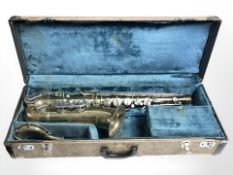 A brass Powertone (Imported by Boosie & Hawkes) saxophone, in storage case.