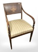 A continental satinwood inlaid armchair in floral striped upholstery.