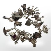 A silver charm bracelet. CONDITION REPORT: 67.9g.