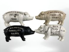 Four painted cast iron pig money banks, length 19 cm.