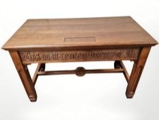 An oak ecclesiastical table, carved with the words 'This Do in Remembrance of Me',