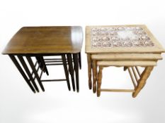 A Danish blonde oak nest of three tile set inset tables and a further nest of tables.