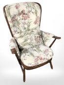 Two Ercol elm lounge armchairs.