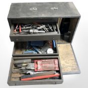 A vintage joiner's tool chest containing various tools and hardware, hand tools, allen keys, etc.