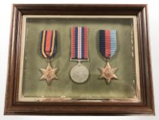 A reproduction set of three WWII medals including Burma Star,