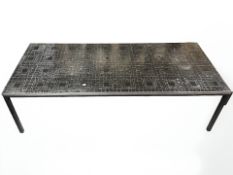 A Scandinavian metal framed rectangular coffee table with black tiled inset top,