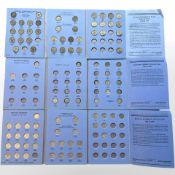 Five Whitman coin folders containing three pence and six pence pieces, florins,