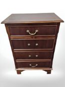 A reproduction mahogany four drawer chest,