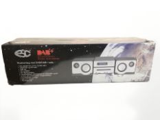 A boxed DAB radio.