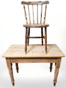 A Victorian pine table, width 100 cm, and an elm spindle back chair.