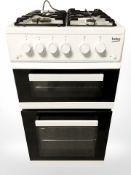 A Beko four burner gas oven.