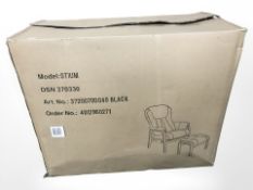 A boxed black Otium armchair and footstool.