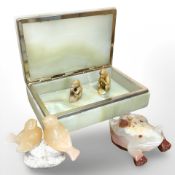 A gilt and onyx table box, width 19 cm, together with four hardstone polished figures.