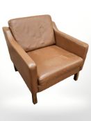 A late 20th century Danish stitched leather armchair,