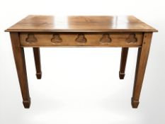 A stained pine ecclesiastical table, 121 cm x 59 cm x 84 cm.