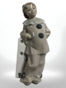 A Lladro figure of a girl dressed as a clown,