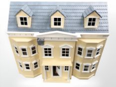 A double fronted doll's house, 76 cm x 45 cm x 67 cm.