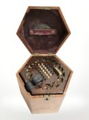 A twenty four button concertina in Lachenal & Co box.