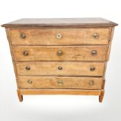 A 19th century oak chest of four drawers, 127 cm x 58 cm x 114 cm.