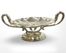 An impressive silver plated table centrepiece, the dish surmounted by the heads of four swans,