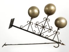 A large wrought iron Pawn Broker's sign, with three decorative silvered globes, length 164 cm.
