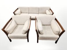 A late 20th century Danish stained wooden framed three piece lounge suite,