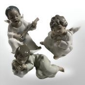 Three Lladro figures of boy angels,