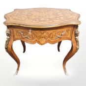A continental walnut and satinwood marquetry inlaid occasional table, fitted a drawer,