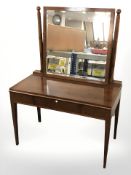 An early 20th century mahogany two drawer dressing table, 106 cm x 56 cm x 143 cm.