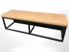 A metal framed rectangular bench with stitched tan leather seat retailed by Ralph Lauren,