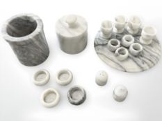 A group of white marble kitchen ware items including storage jars, serviette rings,