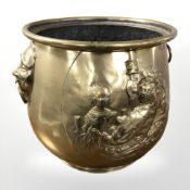 A 19th century Dutch brass coal bucket with twin mask handles,