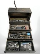 A vintage joiner's tool chest containing various tools and hardware, drill bits, etc.