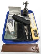 Parker pens, drawing compasses, rules, magnifying glass,