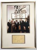 A group of celebrity photographs with accompanying signatures including Evander Holyfield,