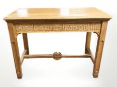 An ecclesiastical oak table carved with the words 'This Do in Remembrance of Me',
