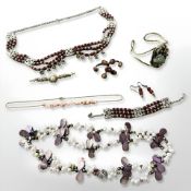 Nine items of jewellery including pearl set necklace, panel necklace with matching bracelet,